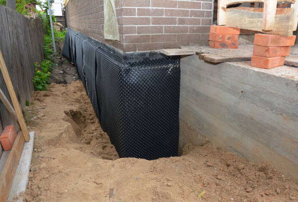 Happy homeowners after waterproofing job in Stanwood